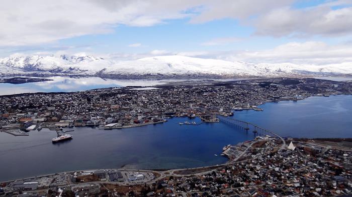 Tromsø and surrounding islands from the top of mountain ledge Storsteinen
