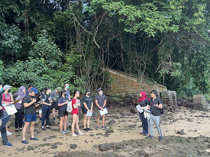 Two of EOS’ PhD students, Gina Sarkawi and Jireh Teo, both on the right, led the first segment of the field trip to Tanjong Rimau (Source: Cheryl Han/Earth Observatory of Singapore)