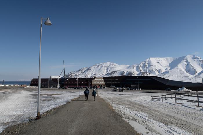 The research team walking to the University of Svalbard