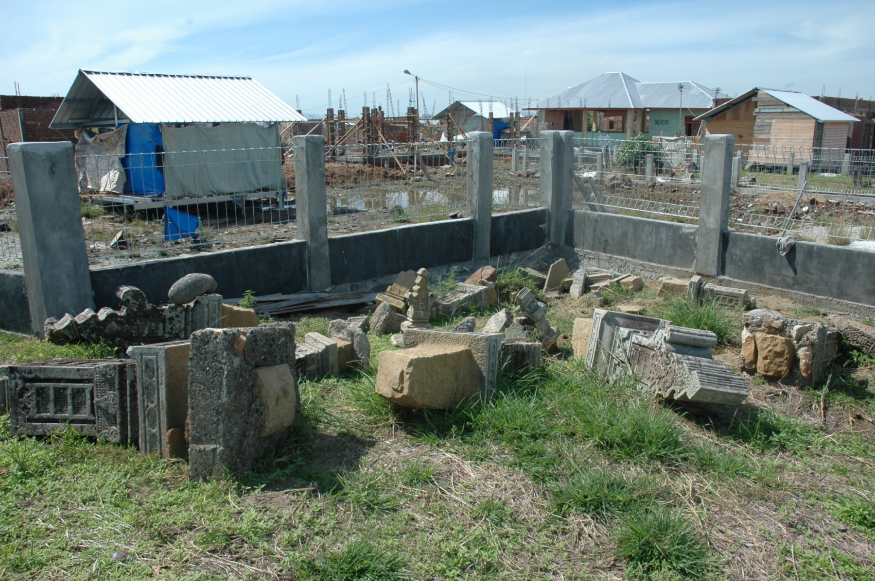 A field of gravestones in Banda Aceh dating, between 1550 and 1800, piled in a corner next a large post-tsunami housing project in 2006 (Source: Patrick Daly/Earth Observatory of Singapore)