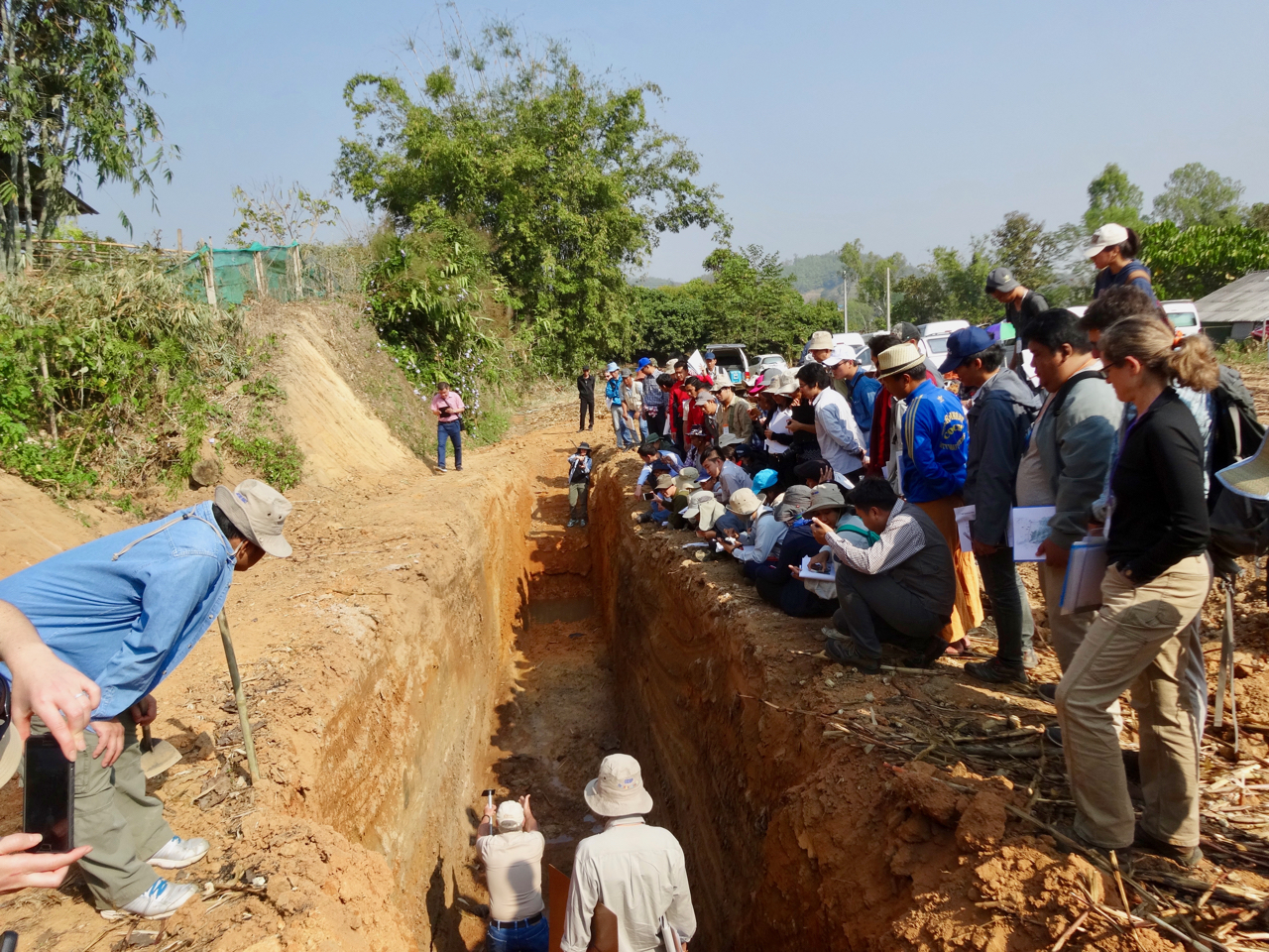 On a field trip to a trench on the Mae Chan fault, Professor Ray Weldon explains his preliminary interpretation of the fault exposure (Source: Tim Dawson)