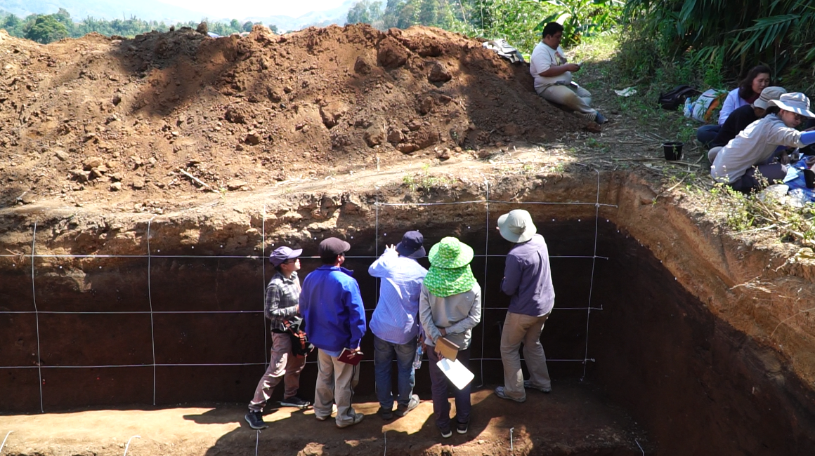 Dr Ashley Streig instructs students on how to collect charcoal samples to be used for dating (Source: Yvonne Soon)