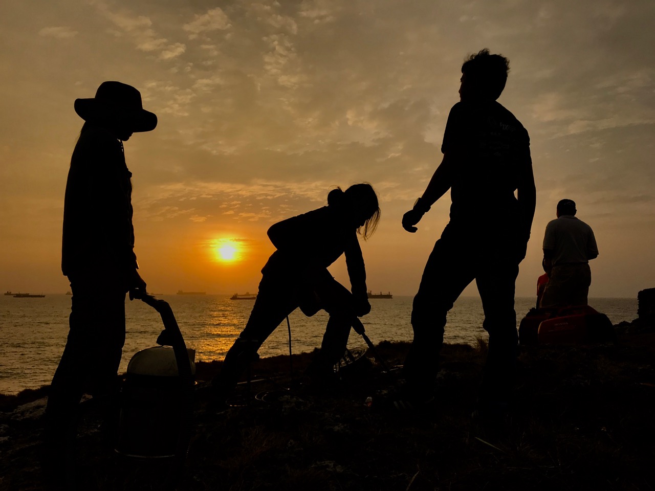 CGO field engineers drilling into a bedrock to install a GPS station in Kaohsiung, Taiwan, to monitor sea level changes (Source: Leong Choong Yew/Earth Observatory of Singapore)