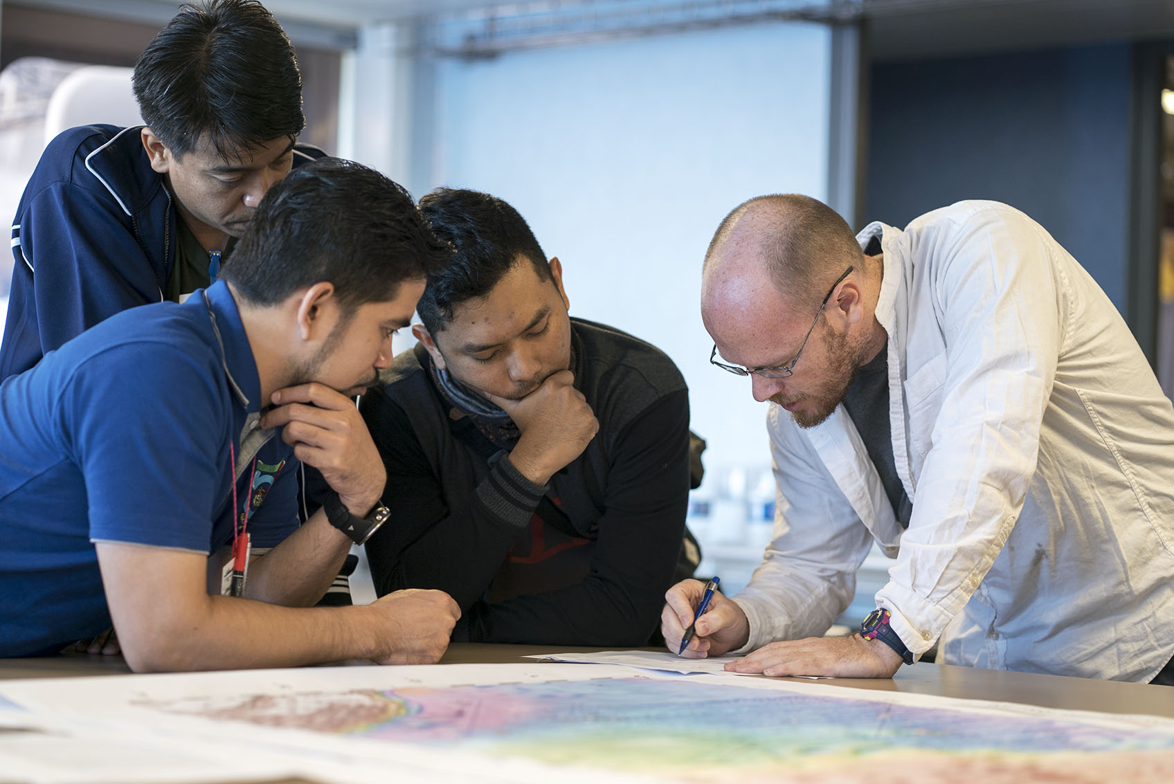 Dr Bradley explains the basics of transform faults to students participating in the Floating Summer School, which hosts 15 students from 8 different countries (Source: EOS/Monika Naranjo Gonzales) Dr Bradley explains the basics of transform faults to students participating in the Floating Summer School, which hosts 15 students from 8 different countries (Source: EOS/Monika Naranjo Gonzales)