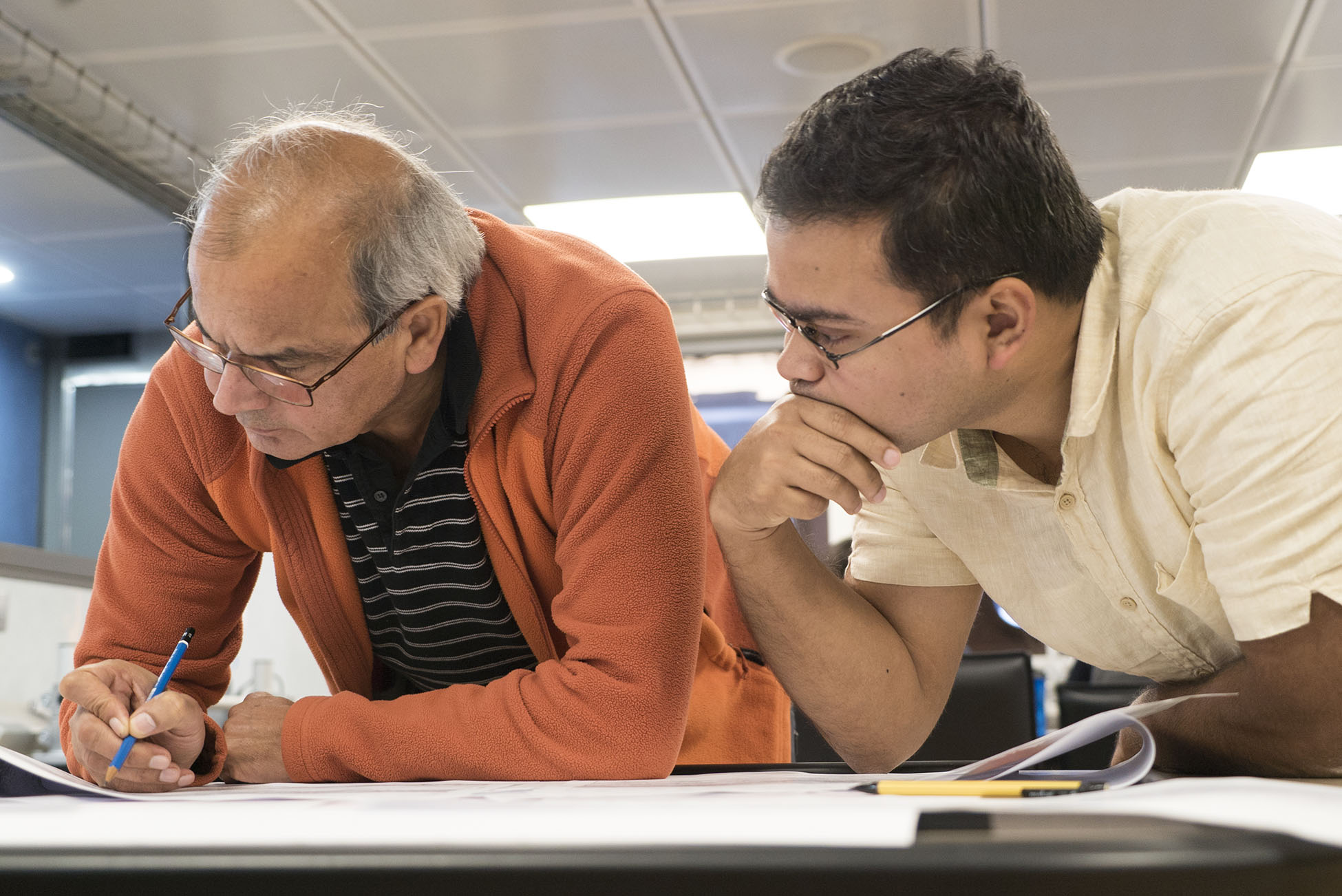 Chief Scientist Dr Satish Singh and geophysicist Dr Sudipta Sarkar, analyse some of the most recent seismic reflection profiles acquired during Mirage II (Source: EOS/ Monika Naranjo Gonzalez) Chief Scientist Dr Satish Singh and geophysicist Dr Sudipta Sarkar, analyse some of the most recent seismic reflection profiles acquired during Mirage II (Source: EOS/ Monika Naranjo Gonzalez)