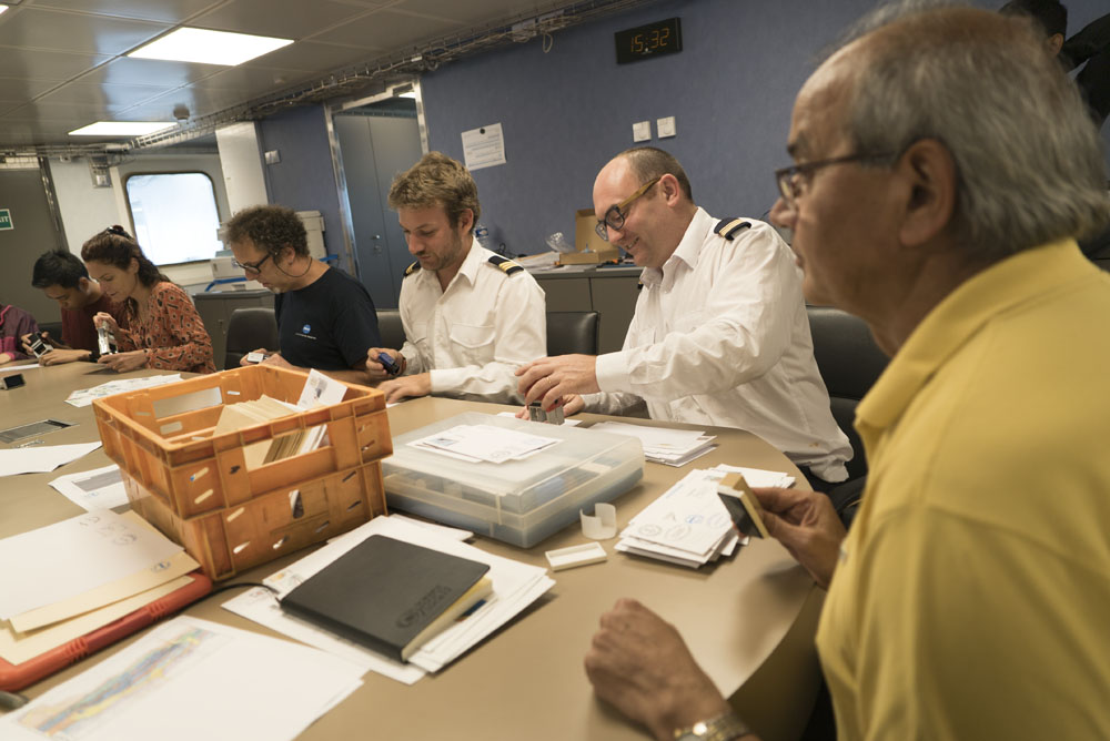 The crew and scientific team participate in a tradition that was born in 1896, with the production of stamps specific to the French Austral islands (Source: EOS/ Monika Naranjo Gonzales)