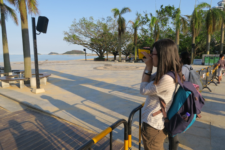 Dr Linlin Li surveys the distance of inundation in post-Hato Zhuhai (Source: Constance Chua) Dr Linlin Li surveys the distance of inundation in post-Hato Zhuhai (Source: Constance Chua)